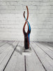 Red & Blue Helix Art Glass Award features a red & blue helix shaped glThis Red & Blue Helix Art Glass Award features a red & blue helix shaped piece of glass mounted on a clear glass base for personalization.This stunning VintaChas Vintage ShopRed & Blue Helix Art Glass Award features