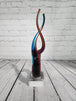 Red & Blue Helix Art Glass Award features a red & blue helix shaped glThis Red & Blue Helix Art Glass Award features a red & blue helix shaped piece of glass mounted on a clear glass base for personalization.This stunning VintaChas Vintage ShopRed & Blue Helix Art Glass Award features