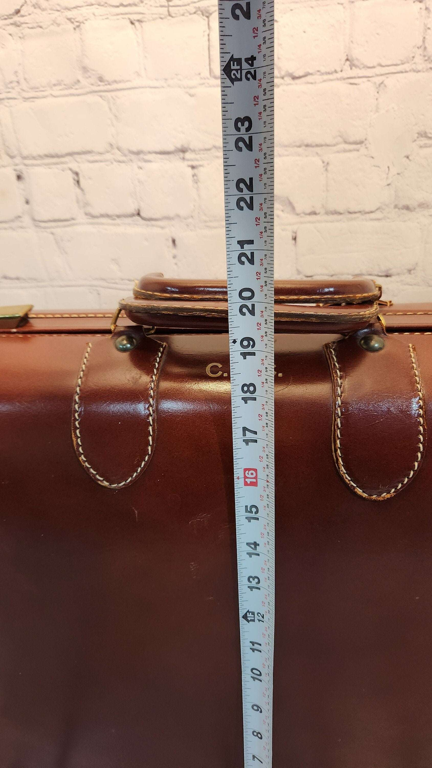 Vintage brown leather suitecase smaller size vintage suitcase mid ceVintage brown leather suitecase SMALLER size of a set of 3 vintage suitcases Mid Century suitecase with protective canvas. Canada Cowhide vintage suitcaseThis vintagChas Vintage ShopVintage brown leather suitecase smaller size vintage suitcase mid century suitecase / protective canvas