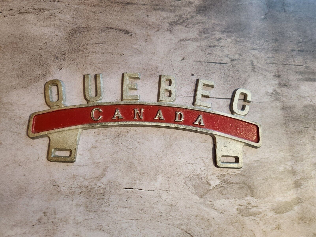 Vintage QUEBEC CANADA License Plate Topper  new old stock never been oVintage License Plate Topper Quebec Canada  License Plate Topper new old stockThis fine exemple of a vintage topper was made in the 1940's in Montreal by Farrell ManChas Vintage ShopVintage QUEBEC CANADA License Plate Topper