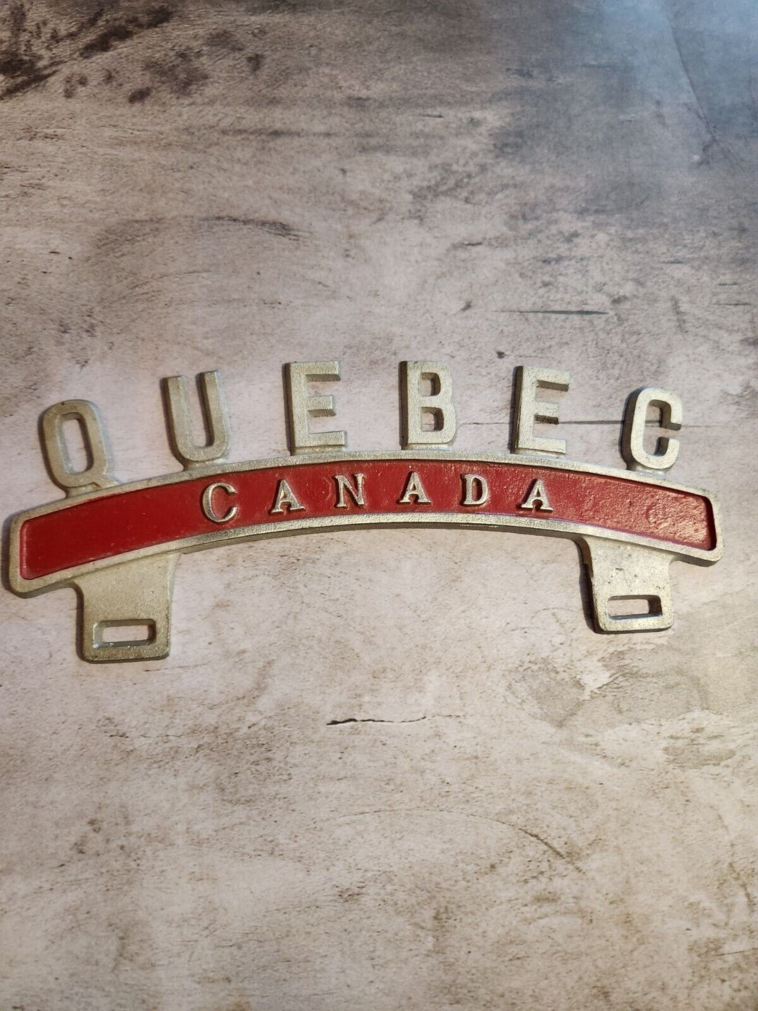 Vintage QUEBEC CANADA License Plate Topper  new old stock never been oVintage License Plate Topper Quebec Canada  License Plate Topper new old stockThis fine exemple of a vintage topper was made in the 1940's in Montreal by Farrell ManChas Vintage ShopVintage QUEBEC CANADA License Plate Topper