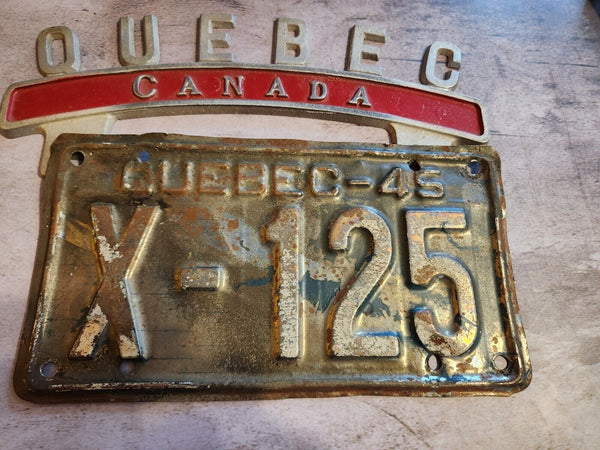 Vintage QUEBEC CANADA License Plate Topper  new old stock never been oVintage License Plate Topper Quebec Canada  License Plate Topper new old stockThis fine exemple of a vintage topper was made in the 1940's in Montreal by Farrell ManChas Vintage ShopVintage QUEBEC CANADA License Plate Topper