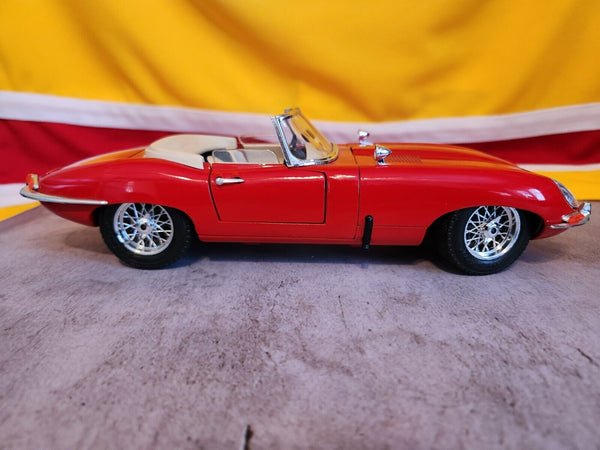 1961 E Type Burago 1/18 Scale Diecast 3016 - 1961 red Jaguar E Type Ca
This is a 1:18 diecast model of a Burago 1961 Jaguar E-Type Convertible in vibrant red with a cream interior is a must-have for any serious 
collector or enthusiastChas Vintage Shop1961