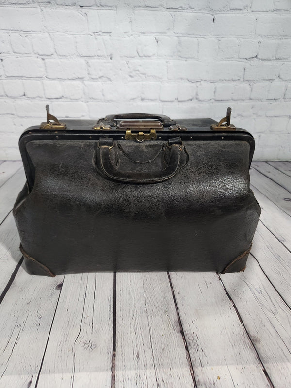 Vintage black cowhide doctor leather bag  antique doctor bag medical lVintage black cowhide Doctor leather bag Antique doctor bag Medical leatherbagYes there are condition issues, but that's what makes it so charming and a great
decoraChas Vintage ShopVintage black cowhide doctor leather bag antique doctor bag medical leatherbag classic md leather bag classic doctor leather bag