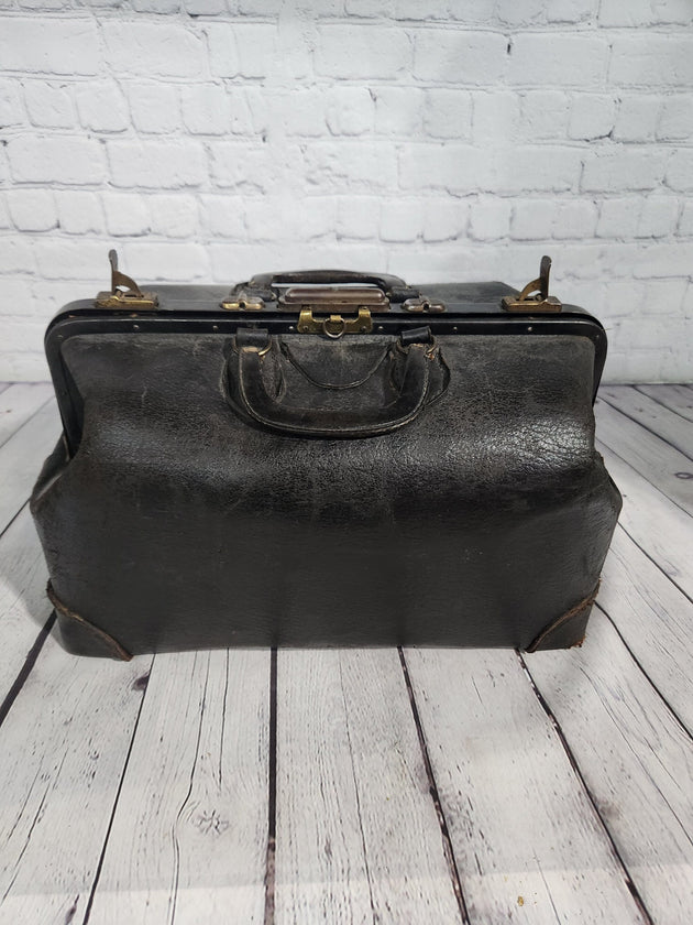 Vintage black cowhide doctor leather bag  antique doctor bag medical lVintage black cowhide Doctor leather bag Antique doctor bag Medical leatherbagYes there are condition issues, but that's what makes it so charming and a great
decoraChas Vintage ShopVintage black cowhide doctor leather bag antique doctor bag medical leatherbag classic md leather bag classic doctor leather bag