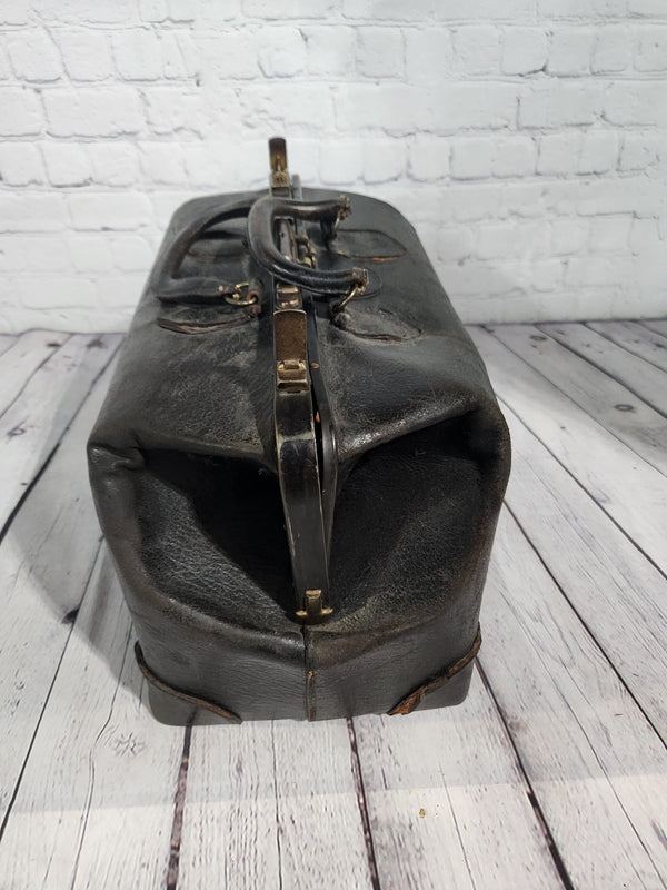 Vintage black cowhide doctor leather bag  antique doctor bag medical lVintage black cowhide Doctor leather bag Antique doctor bag Medical leatherbagYes there are condition issues, but that's what makes it so charming and a great
decoraChas Vintage ShopVintage black cowhide doctor leather bag antique doctor bag medical leatherbag classic md leather bag classic doctor leather bag