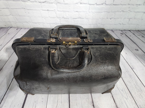 Vintage black cowhide doctor leather bag  antique doctor bag medical lVintage black cowhide Doctor leather bag Antique doctor bag Medical leatherbagYes there are condition issues, but that's what makes it so charming and a great
decoraChas Vintage ShopVintage black cowhide doctor leather bag antique doctor bag medical leatherbag classic md leather bag classic doctor leather bag