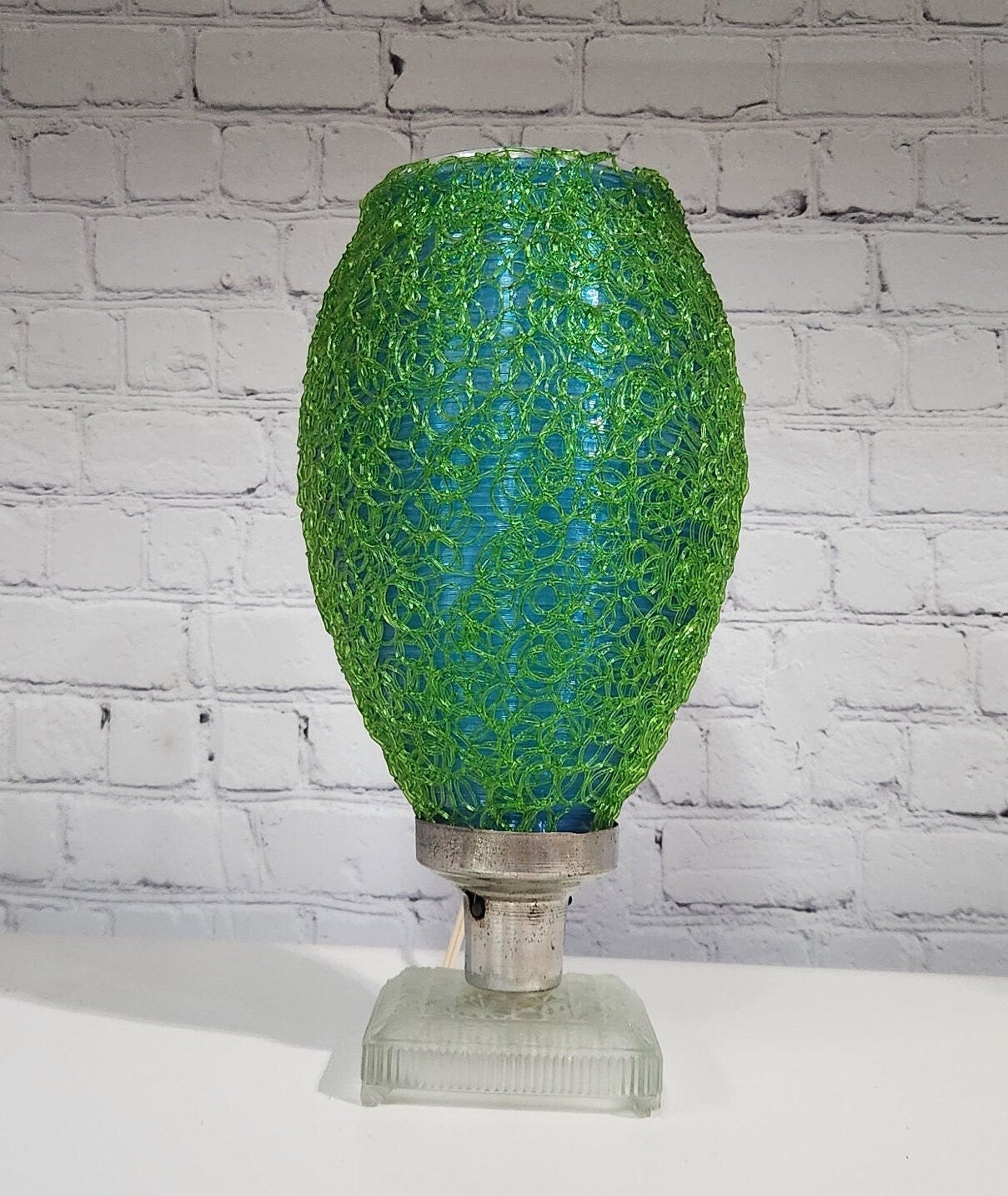 Green and blue lucite spaghetti lamp vintage lamp retro lamp mid centuCool green twisted lucite lamp with a glass baseThis spaghetti / Mid century lamp is a great display piece !The lamp is almost 14 inches tall and 4 1/ inches in diamChas Vintage Shopblue lucite spaghetti lamp vintage lamp retro lamp mid century modern lamp