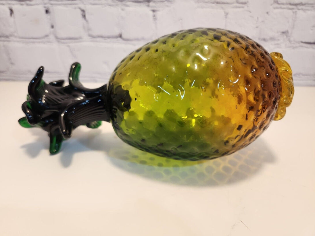 Hand blown glass pineapple murano style amber and greenThis vintage Hand Blown Glass Pineapple is a stunning piece of art that will instantly add a retro vibe to any space. The Murano-style pineapple features a beautifulChas Vintage ShopHand blown glass pineapple murano style amber