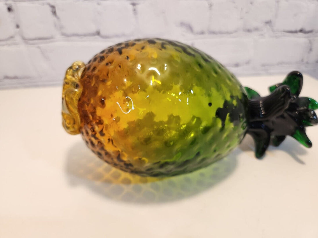 Hand blown glass pineapple murano style amber and greenThis vintage Hand Blown Glass Pineapple is a stunning piece of art that will instantly add a retro vibe to any space. The Murano-style pineapple features a beautifulChas Vintage ShopHand blown glass pineapple murano style amber