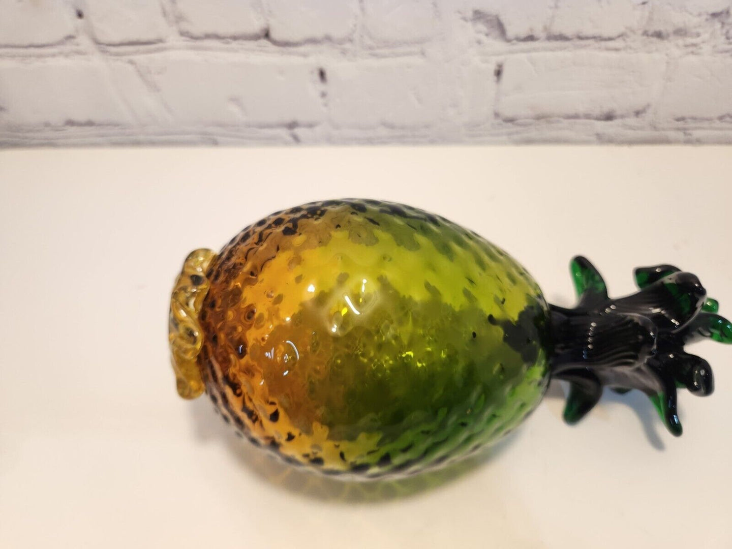 Hand blown glass pineapple murano style amber and greenThis vintage Hand Blown Glass Pineapple is a stunning piece of art that will instantly add a retro vibe to any space. The Murano-style pineapple features a beautifulChas Vintage ShopHand blown glass pineapple murano style amber