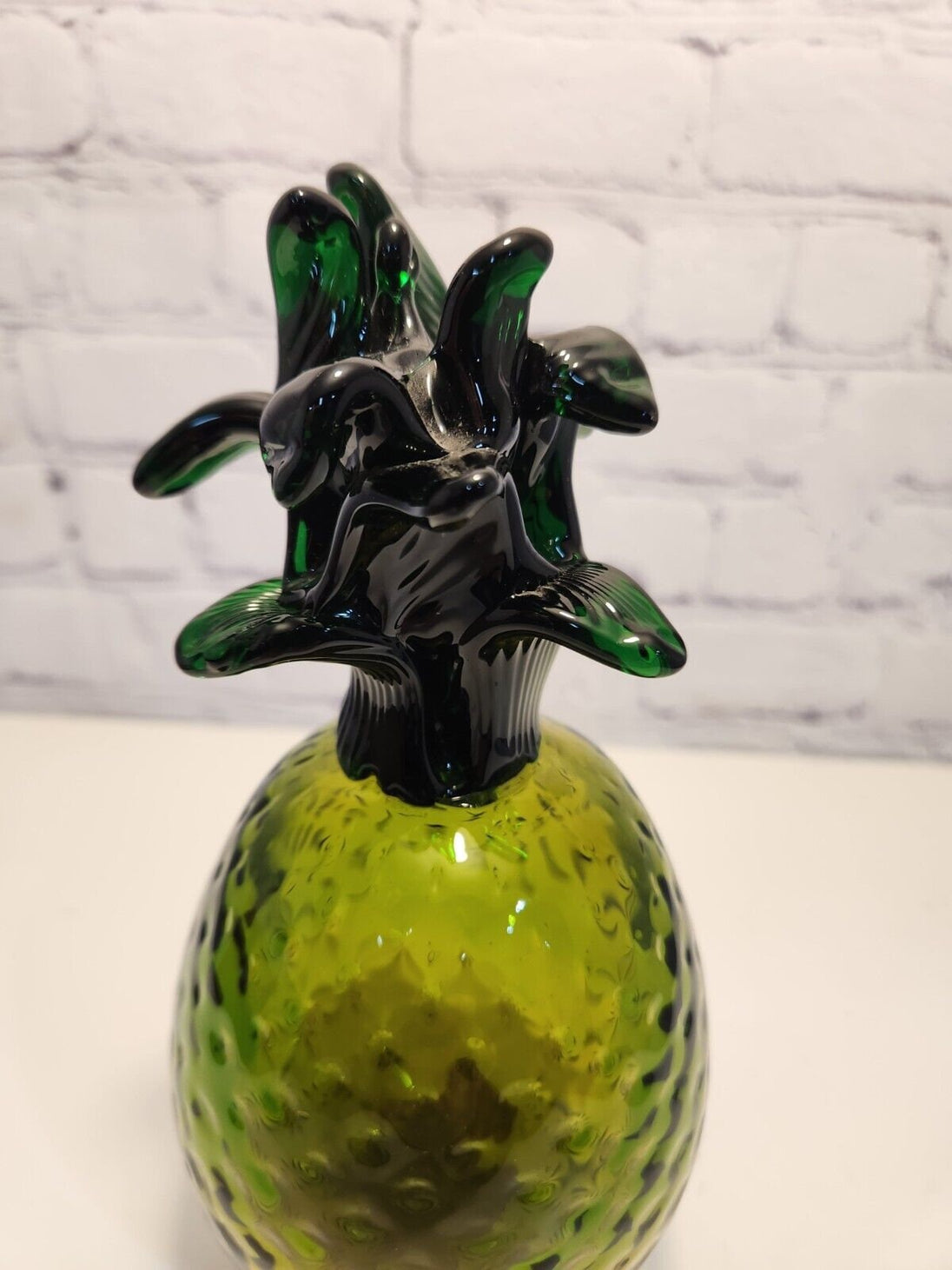 Hand blown glass pineapple murano style amber and greenThis vintage Hand Blown Glass Pineapple is a stunning piece of art that will instantly add a retro vibe to any space. The Murano-style pineapple features a beautifulChas Vintage ShopHand blown glass pineapple murano style amber