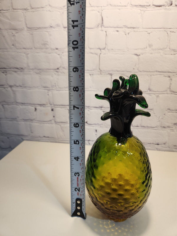 Hand blown glass pineapple murano style amber and greenThis vintage Hand Blown Glass Pineapple is a stunning piece of art that will instantly add a retro vibe to any space. The Murano-style pineapple features a beautifulChas Vintage ShopHand blown glass pineapple murano style amber