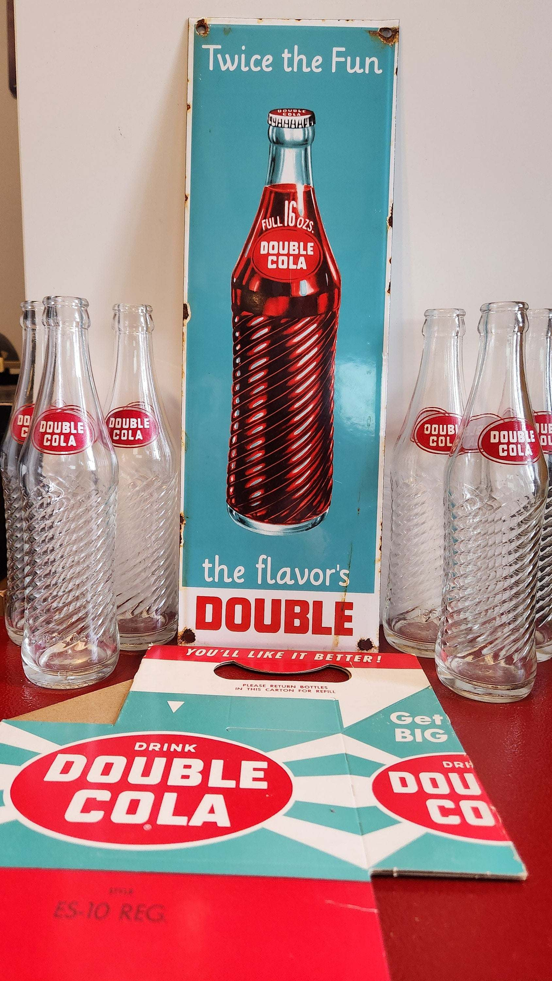 Bring back the good times with this  double cola collector six pack anRelive the nostalgia of the classic Double Cola with this amazing collector set!This set includes a porcelain Double Cola sign, six Double Cola bottles, and a DoubleChas Vintage Shopdouble cola collector