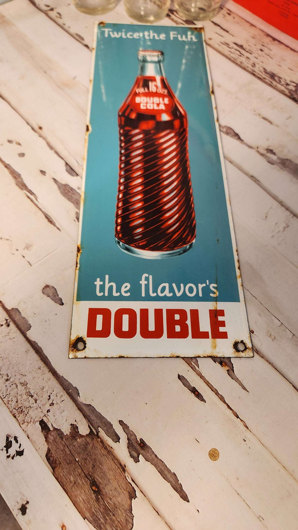 Bring back the good times with this  double cola collector six pack anRelive the nostalgia of the classic Double Cola with this amazing collector set!This set includes a porcelain Double Cola sign, six Double Cola bottles, and a DoubleChas Vintage Shopdouble cola collector