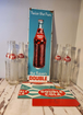 Bring back the good times with this  double cola collector six pack anRelive the nostalgia of the classic Double Cola with this amazing collector set!This set includes a porcelain Double Cola sign, six Double Cola bottles, and a DoubleChas Vintage Shopdouble cola collector