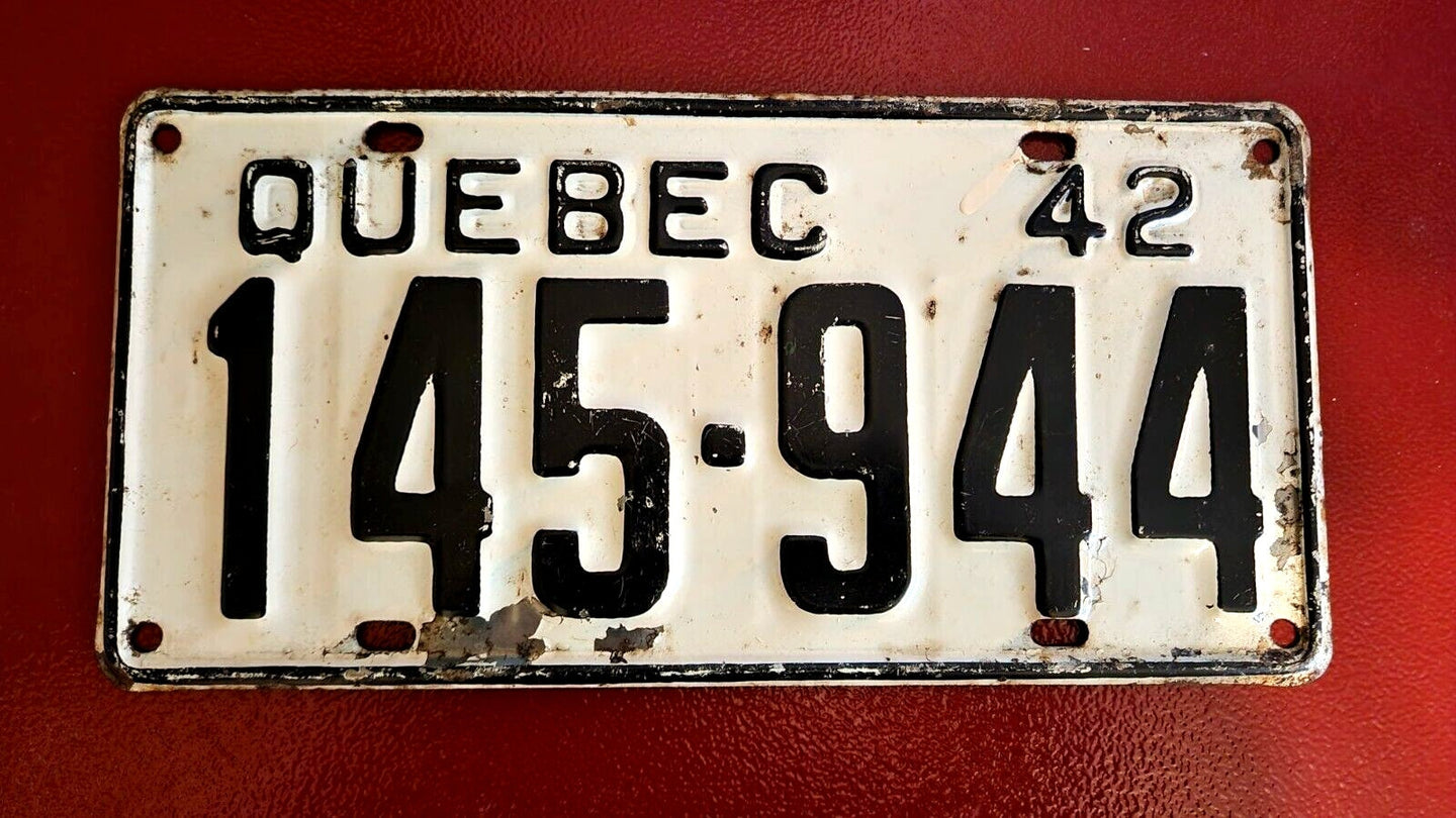 Quebec 1942 licence plate - vintage quebec car licence plateVintage Quebec car licence plate from 1942. This authentic license plate from Quebec is a perfect addition to your collection of automobilia and transportation memorChas Vintage ShopQuebec 1942 licence plate - vintage quebec car licence plate