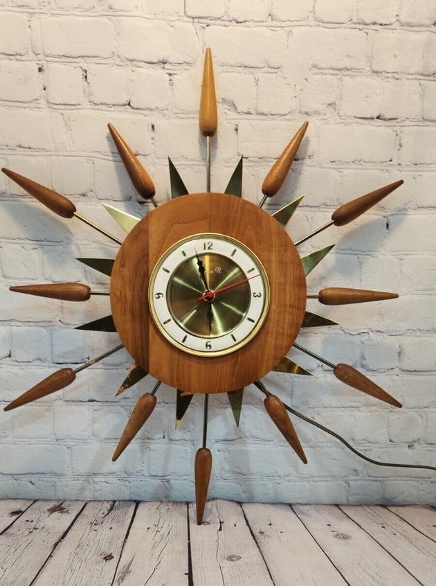 Vintage mid century  sunburst 1960s wall clock, 24" inches real not reAdd a touch of vintage flair to your home decor with this stunning 1960s sunburst wall clock. The clock features a charming starburst design, with a round shape and Chas Vintage ShopVintage mid century sunburst 1960s wall clock, 24" inches real