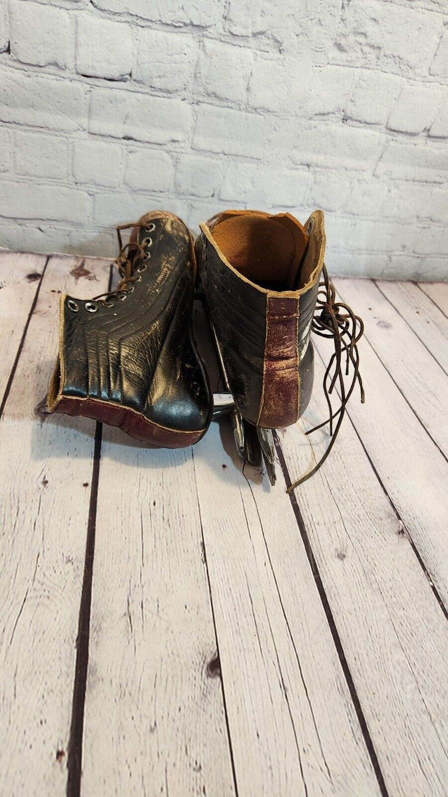 Antique  black ccm hockey skates size 11 leather 1930s  two tone vtg  Rare Vintage CCM Hockey Skates Size 11 two tone Leather from the 1930s  These classic skates are a piece of hockey history. Made by CCM in Canada, the brown leather Chas Vintage ShopAntique black ccm hockey skates size 11 leather 1930s