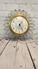 Vintage mid century  sunburst 1960s westclox wall clock, 11" inches. rAdd a touch of retro charm to your home with this vintage mid-century Westclox wall clock. The clock features a round shape with a gold-tone metal frame sunburst desChas Vintage ShopVintage mid century sunburst 1960s westclox wall clock, 11" inches