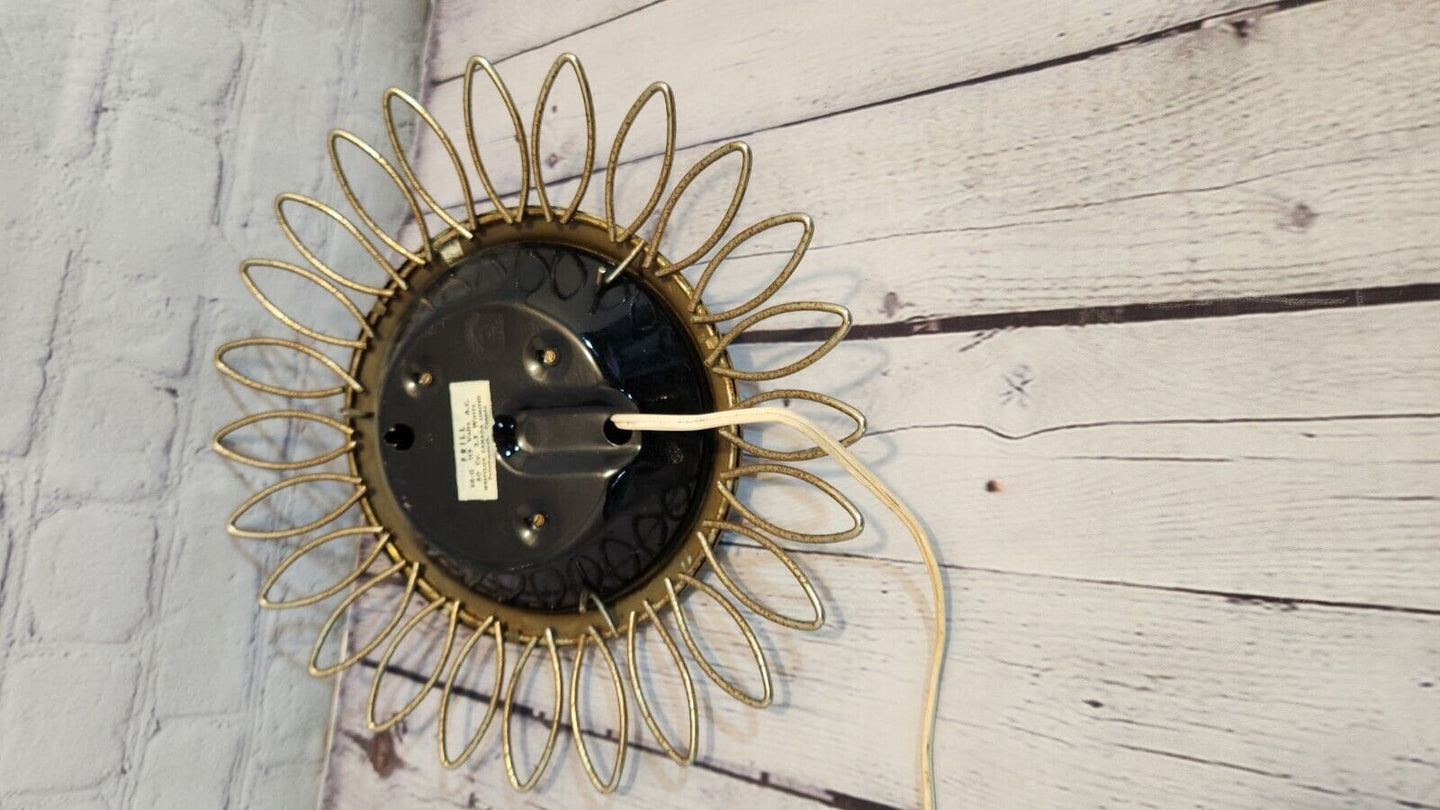 Vintage mid century  sunburst 1960s westclox wall clock, 11" inches. rAdd a touch of retro charm to your home with this vintage mid-century Westclox wall clock. The clock features a round shape with a gold-tone metal frame sunburst desChas Vintage ShopVintage mid century sunburst 1960s westclox wall clock, 11" inches