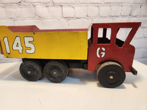 Vintage hand made toy truck  wood / metal dump truck  vintage handcrafThis vintage dump truck is a unique find for any collector or lover of handcrafted toys. Made of wood and metal, this truck was hand made in Canada in 1966. It is reChas Vintage ShopVintage hand made toy truck wood / metal dump truck vintage handcrafted toys