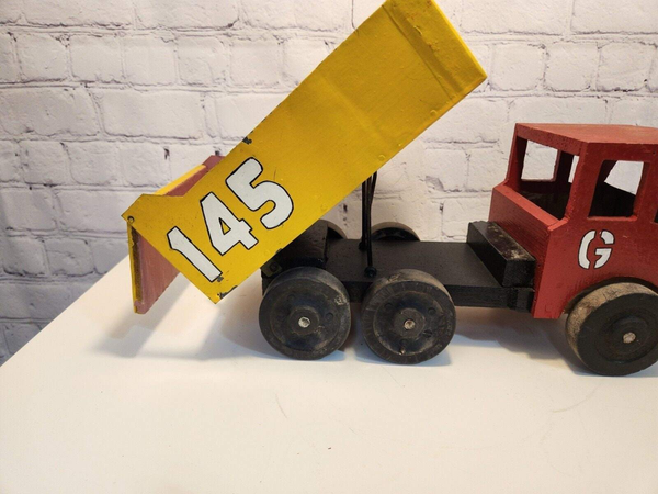 Vintage hand made toy truck  wood / metal dump truck  vintage handcrafThis vintage dump truck is a unique find for any collector or lover of handcrafted toys. Made of wood and metal, this truck was hand made in Canada in 1966. It is reChas Vintage ShopVintage hand made toy truck wood / metal dump truck vintage handcrafted toys