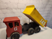 Vintage hand made toy truck  wood / metal dump truck  vintage handcrafThis vintage dump truck is a unique find for any collector or lover of handcrafted toys. Made of wood and metal, this truck was hand made in Canada in 1966. It is reChas Vintage ShopVintage hand made toy truck wood / metal dump truck vintage handcrafted toys