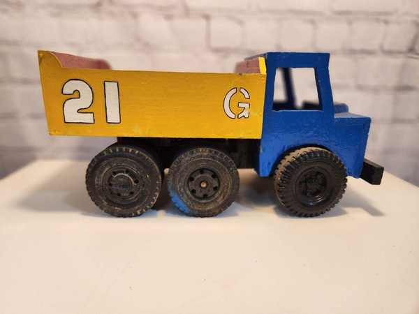 Vintage hand made toy truk  wood / metal dump truck  vintage handcraftThis vintage dump truck is a unique find for any collector or lover of handcrafted toys. Made of wood and metal, this truck was hand made in Canada in 1964. It is reChas Vintage ShopVintage hand made toy truk wood / metal dump truck vintage handcrafted toys