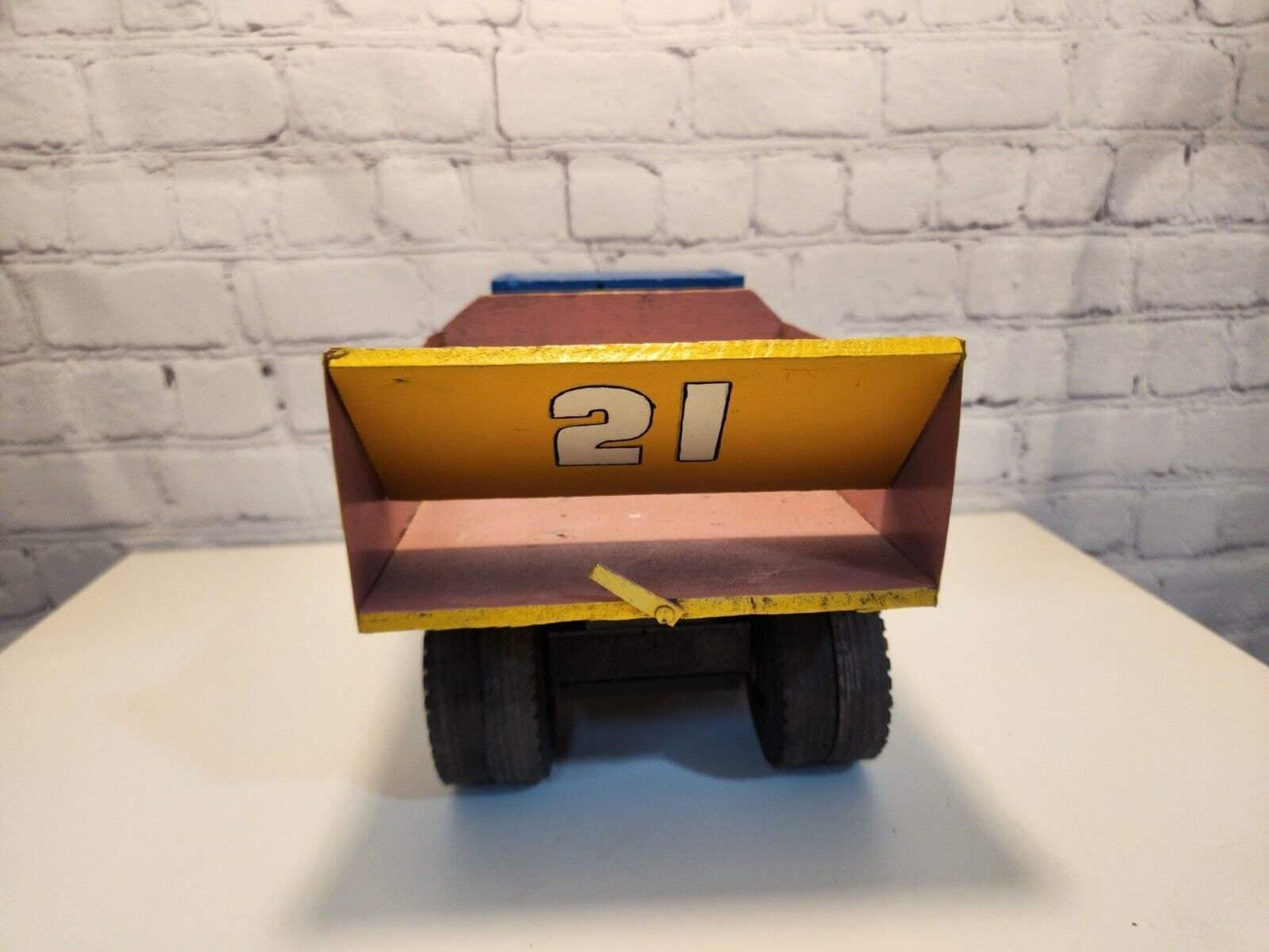 Vintage hand made toy truk  wood / metal dump truck  vintage handcraftThis vintage dump truck is a unique find for any collector or lover of handcrafted toys. Made of wood and metal, this truck was hand made in Canada in 1964. It is reChas Vintage ShopVintage hand made toy truk wood / metal dump truck vintage handcrafted toys