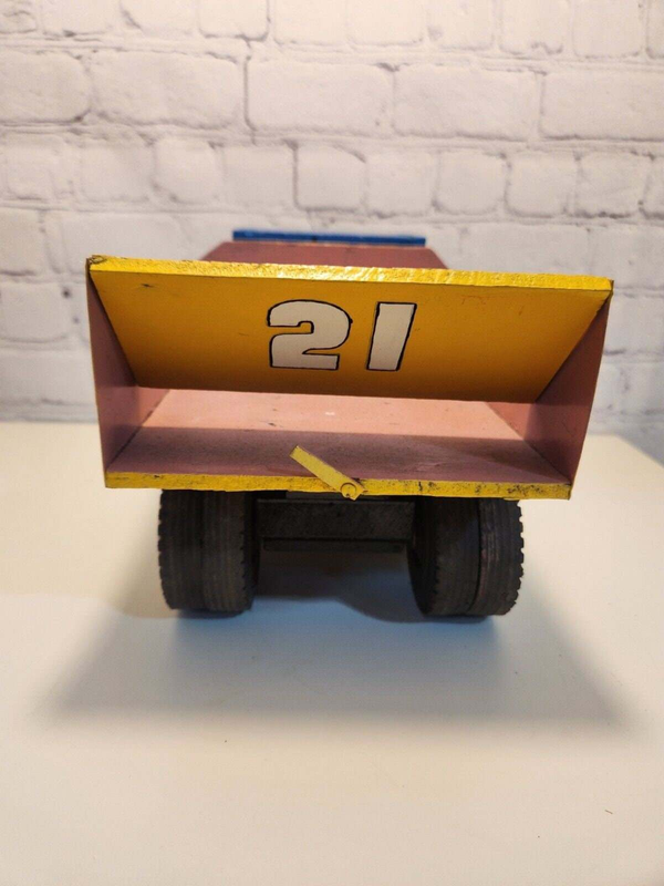 Vintage hand made toy truk  wood / metal dump truck  vintage handcraftThis vintage dump truck is a unique find for any collector or lover of handcrafted toys. Made of wood and metal, this truck was hand made in Canada in 1964. It is reChas Vintage ShopVintage hand made toy truk wood / metal dump truck vintage handcrafted toys