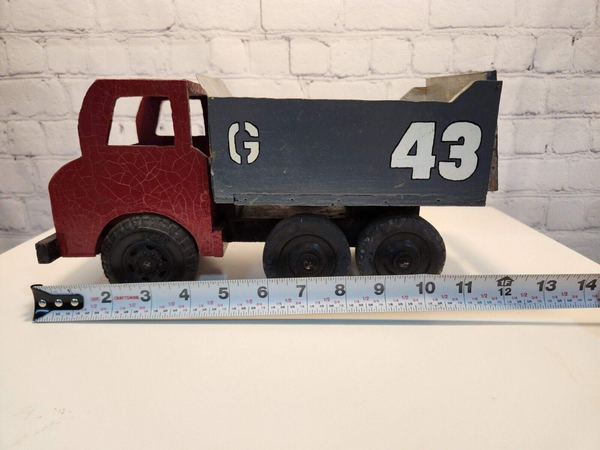 Vintage hand made toy truk  wood / metal dump truck  vintage handcraftThis vintage dump truck is a unique find for any collector or lover of handcrafted toys. Made of wood and metal, this truck was hand made in Canada in 1966. It is reChas Vintage ShopVintage hand made toy truk wood / metal dump truck vintage handcrafted toys