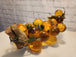 Vtg mcm cluster of large amber honey  lucite acrylic grapes  with plasThis vintage mid-century cluster of large amber honey lucite acrylic grapes with plastic leaves is a timeless piece of art that will add a touch of elegance to any sChas Vintage Shoplarge amber honey lucite acrylic grapes