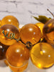 Vtg mcm cluster of large amber honey  lucite acrylic grapes  with plasThis vintage mid-century cluster of large amber honey lucite acrylic grapes with plastic leaves is a timeless piece of art that will add a touch of elegance to any sChas Vintage Shoplarge amber honey lucite acrylic grapes