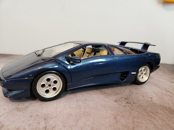 Blue 1990  burago lamborghini countach  1:18 die cast made in italyThis 1:18 die-cast Lamborghini Countach from Burago's Bburago Gold series is a stunning addition to any car enthusiast's collection. Made in Italy in 1990, the blue Chas Vintage ShopBlue 1990 burago lamborghini countach 1