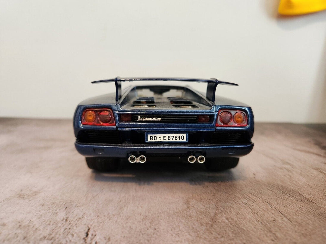 Blue 1990  burago lamborghini countach  1:18 die cast made in italyThis 1:18 die-cast Lamborghini Countach from Burago's Bburago Gold series is a stunning addition to any car enthusiast's collection. Made in Italy in 1990, the blue Chas Vintage ShopBlue 1990 burago lamborghini countach 1