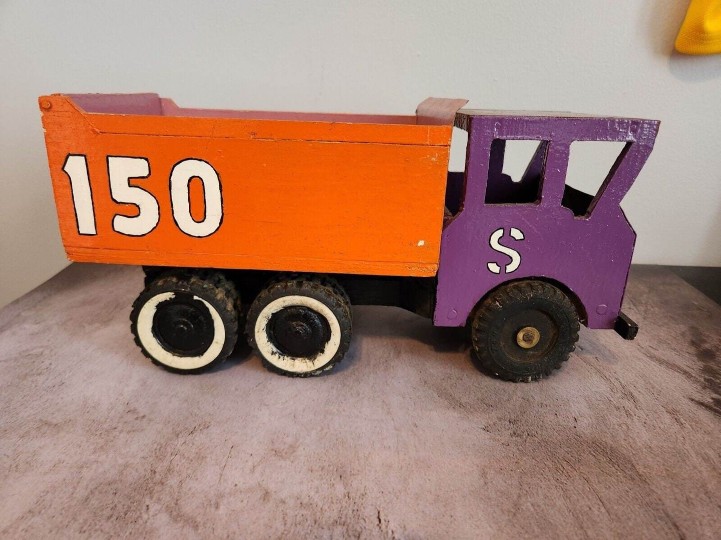 Vintage hand made wood and metal dump truck from 1966This vintage dump truck is a unique find for any collector or lover of handcrafted toys. Made of wood and metal, this truck was hand made in Canada in 1966. It is reChas Vintage ShopVintage hand made wood