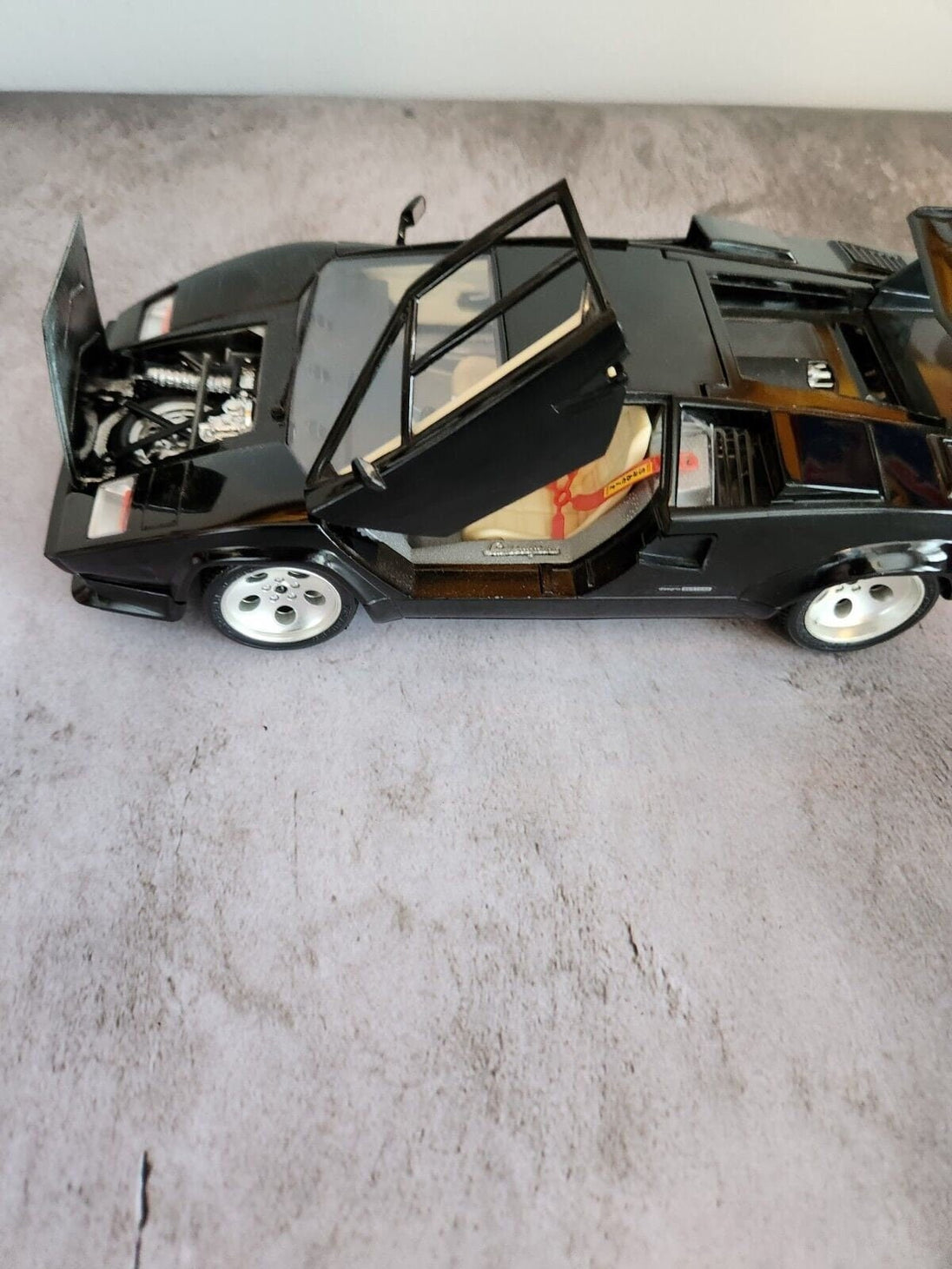 Black  burago lamborghini countach  1:18 die cast made in italyThis 1:18 scale diecast model of a 1988 Lamborghini Countach is a stunning addition to any car enthusiast's collection. Made by Burago, a renowned Italian brand, theChas Vintage ShopBlack burago lamborghini countach 1