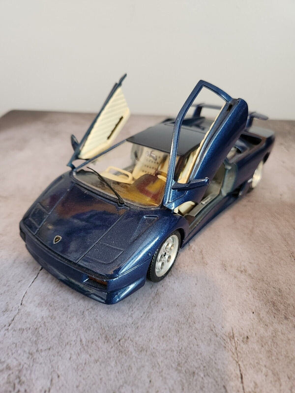 Blue 1990  burago lamborghini countach  1:18 die cast made in italyThis 1:18 die-cast Lamborghini Countach from Burago's Bburago Gold series is a stunning addition to any car enthusiast's collection. Made in Italy in 1990, the blue Chas Vintage ShopBlue 1990 burago lamborghini countach 1