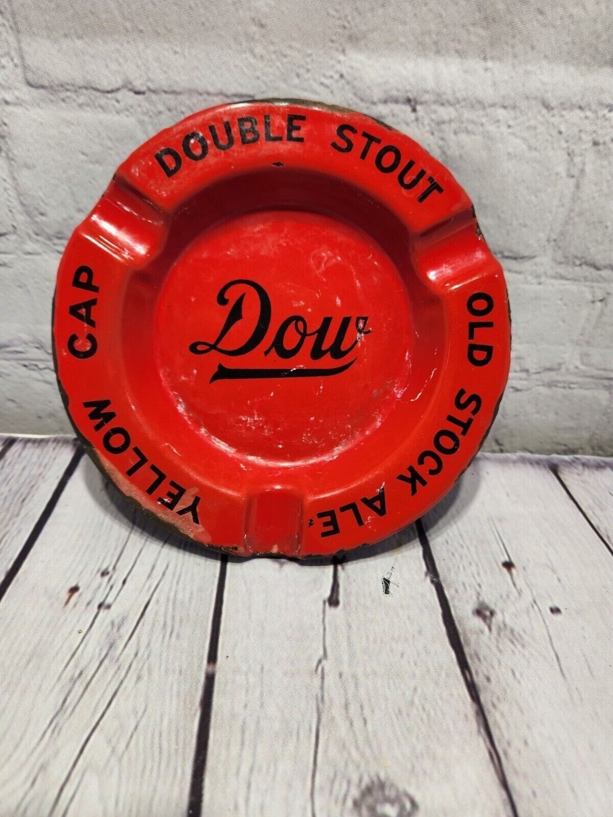 Vintage dow brewery porcelain  ashtray dow double stout old stock yellThis vintage Dow brewery red porcelain over steel ashtray is a must-have for collectors of breweriana. Made in Canada, it features the logos of DOW Double Stout, OldChas Vintage ShopVintage dow brewery porcelain ashtray dow double stout