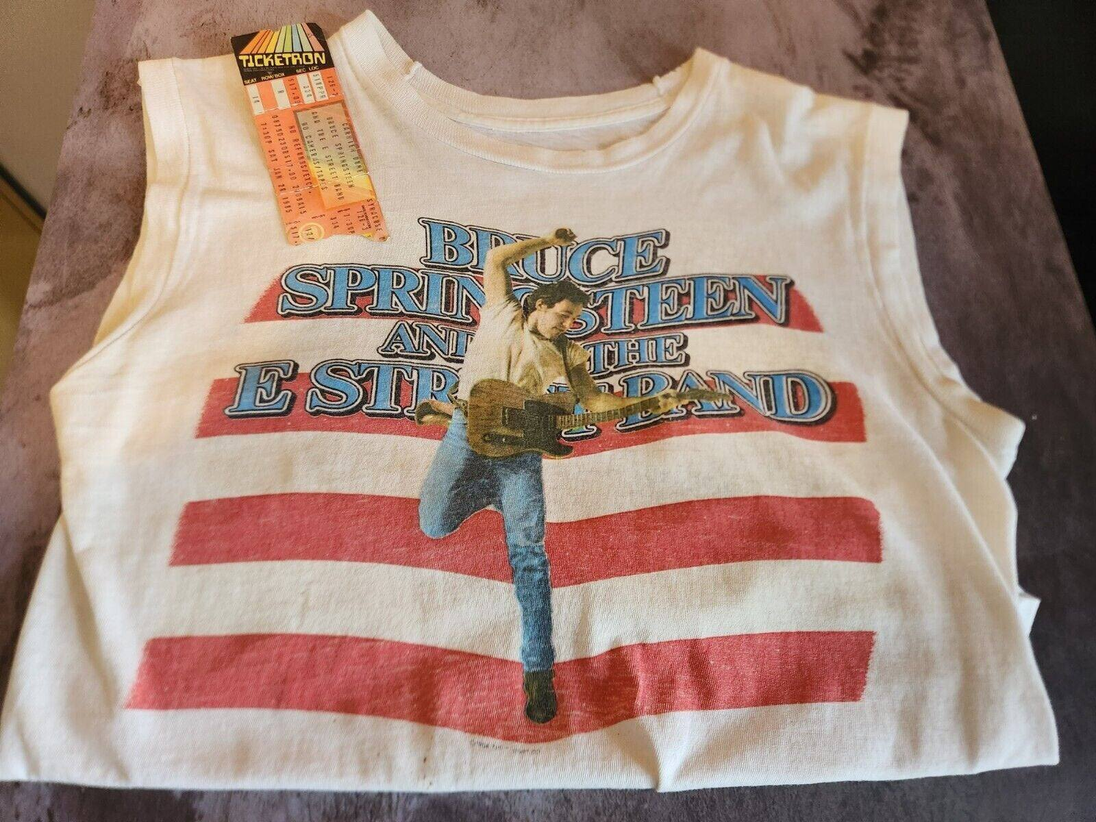 Bruce springsteen t shirt + show ticket from the  born in the usa 84-8BORN IN THE USA TOUR Memorabilia T-shirt AND concert ticket !Bruce Springsteen T shirt and ticket from the Born in he the USA 84-85 tour I bought this new at Bruce sChas Vintage Shopshirt + show ticket