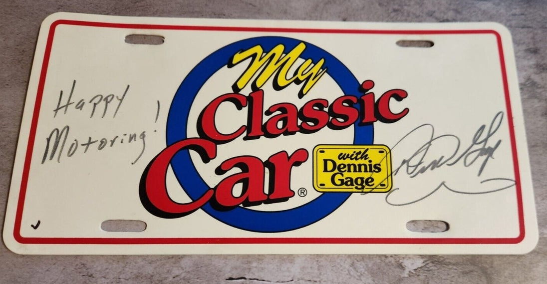 My classic car souvenir licence plate signed by dennis gage happy motoMy classic car souvenir licence plate signed by Dennis Gage Happy Motoring !This plasctic souvenir licence plate eas signed by Dennis Gage at some carevent. I have nChas Vintage Shopclassic car souvenir licence plate signed