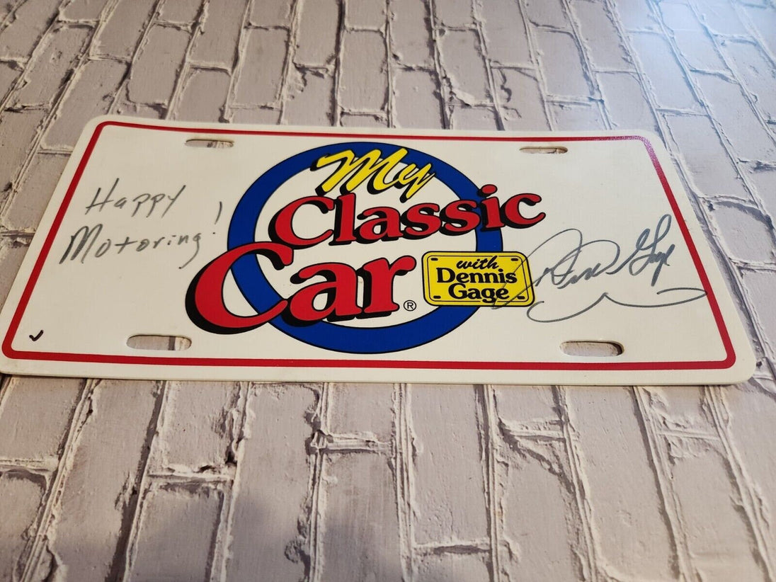 My classic car souvenir licence plate signed by dennis gage happy motoMy classic car souvenir licence plate signed by Dennis Gage Happy Motoring !This plasctic souvenir licence plate eas signed by Dennis Gage at some carevent. I have nChas Vintage Shopclassic car souvenir licence plate signed