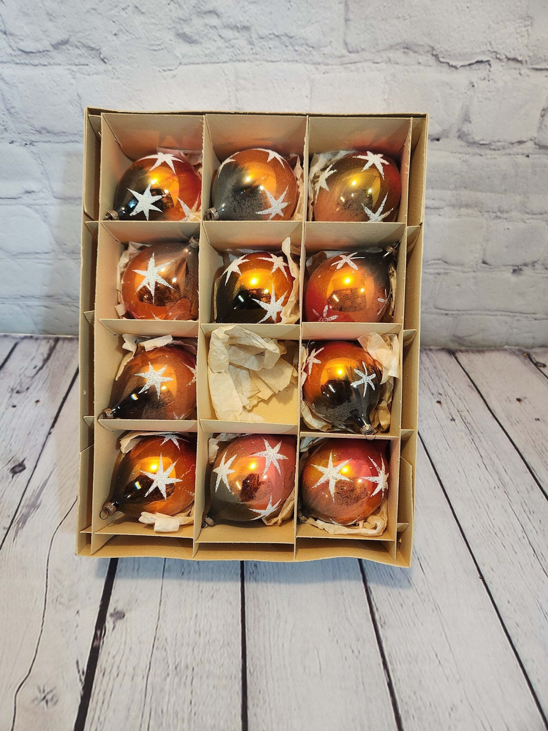 Vintage christmas gold copper ornaments - box of 11 from the 60's unbrA nice box of 11 old glass Christmas balls from the 60s.The box is in good condition
The balls are 2 5/8 inches in diameter.They are in good conditionPlease contact Chas Vintage Shopunbranded vintage christmas ornaments christmas tree vintage ornaments