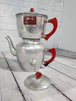 Art deco mid  century modern drip coffee pot / tea pot  with red bakelArt Deco Mid Century Modern drip coffee pot / tea pot with red bakelite handlescute vintage aluminum coffee pot with red Bakelite handleThis is a very cute Filtro drChas Vintage ShopArt deco mid century modern drip coffee pot / tea pot