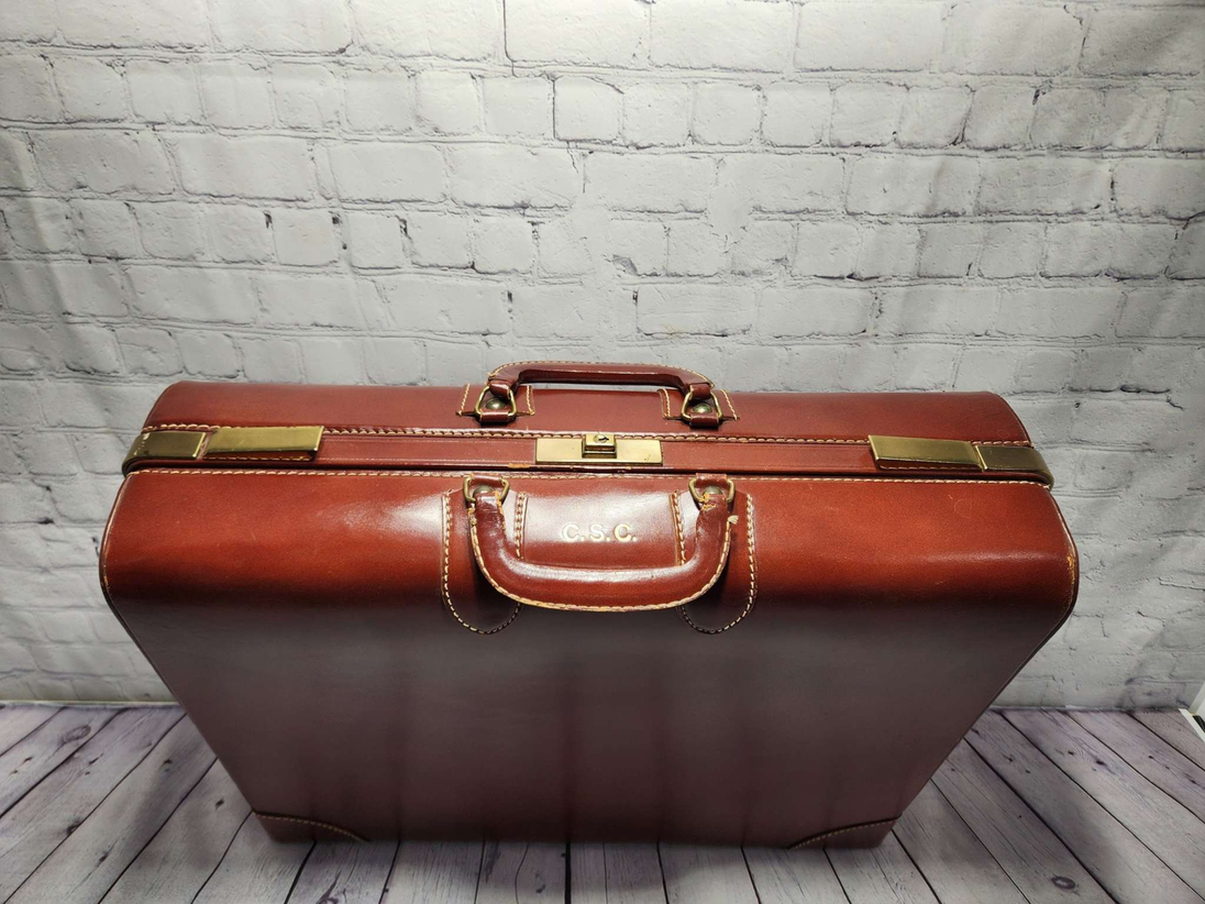 Vintage brown leather suitecase medium size vintage suitcase  mid centVintage brown leather suitecase Medium size vintage suitcase Mid Centurysuitecase with protective canvas. Canada top grain cowhide vintage suitcaseThis vintage, heavChas Vintage ShopVintage brown leather suitecase medium size vintage suitcase mid century suitecase