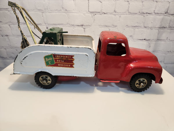 Buddy l vintage toy tow truck vintage buddy l emergency auto wrecker tBuddy L vintage toy tow truck Vintage Buddy L Emergency Auto Wrecker Tow Truck -Pressed Steel Toy - 16”The Truck has some paint loss, which can be seen in the photosChas Vintage Shopemergency auto wrecker tow truck - pressed steel toy - 16”