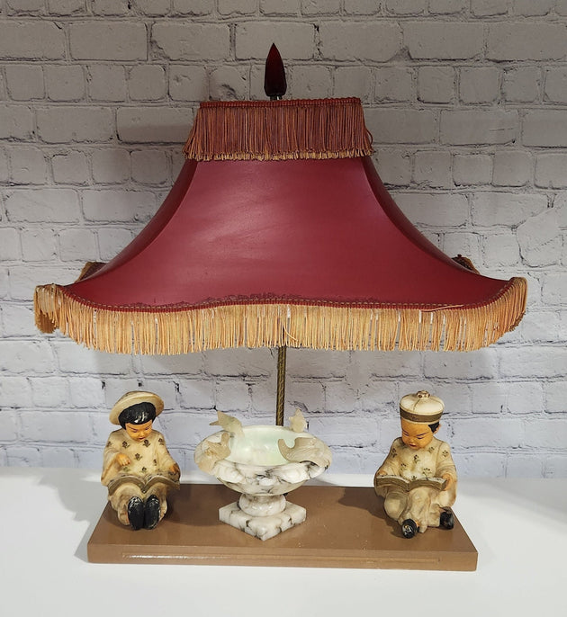 Kitsch vintage chinese lamp 1950's lampKitsch vintage chinese lamp lamp in the shape of a made in the 50s /60This vintage beauty has marble sculpted kids, birds and water fountain !Cool center piece decorChas Vintage ShopKitsch vintage chinese lamp 1950'