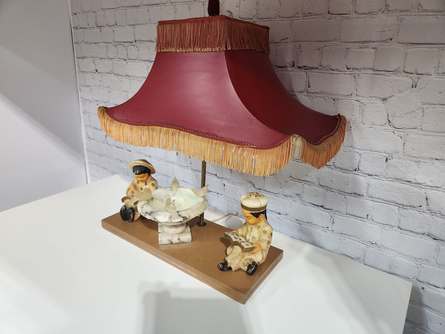 Kitsch vintage chinese lamp 1950's lampKitsch vintage chinese lamp lamp in the shape of a made in the 50s /60This vintage beauty has marble sculpted kids, birds and water fountain !Cool center piece decorChas Vintage ShopKitsch vintage chinese lamp 1950'