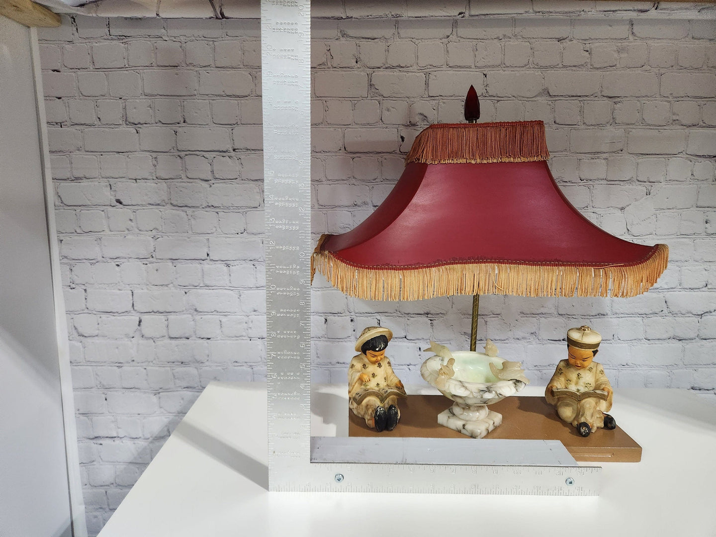 Kitsch vintage chinese lamp 1950's lampKitsch vintage chinese lamp lamp in the shape of a made in the 50s /60This vintage beauty has marble sculpted kids, birds and water fountain !Cool center piece decorChas Vintage ShopKitsch vintage chinese lamp 1950'